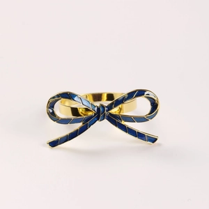 Golden alloy bow napkin ring with dark blue enamel pattern for elegant wedding table decor