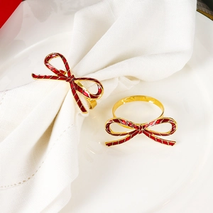Elegant red bow napkin rings with gold alloy finish for luxury wedding table decor