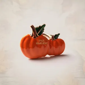 Close-up of Halloween pumpkin napkin ring with orange enamel and gold finish details