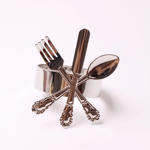 Polished silver metal napkin ring with miniature fork, knife, and spoon decorative details