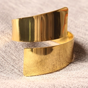Minimalist gold plated spiral open bangle bracelet with a high polish mirror finish