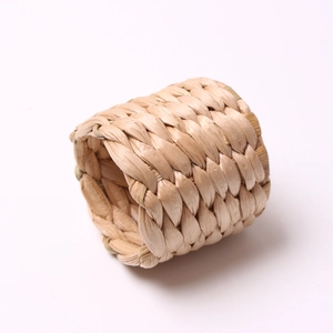 Natural hand-woven water hyacinth napkin ring with minimalist braided straw texture