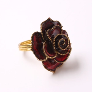 Elegant red rose napkin ring with golden metallic edges for wedding tabletop decor