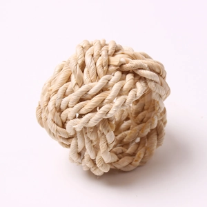 Detailed view of hand-woven natural seagrass napkin ring with textured knot design