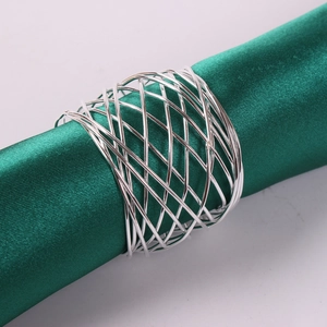 Close-up of silver mesh woven napkin ring with a modern hollow metal wire texture