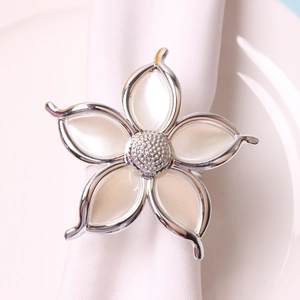 Elegant five-petal flower napkin ring with pearl finish and silver-plated alloy frame