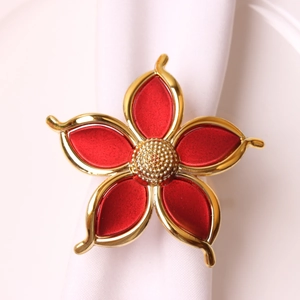 Elegant red and gold five-petal flower napkin ring with a polished metallic finish