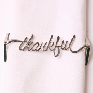Elegant silver thankful napkin ring in polished metal for upscale hotel dining decor