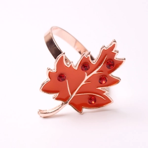 Orange maple leaf napkin ring with red rhinestones and rose gold base for autumn decor