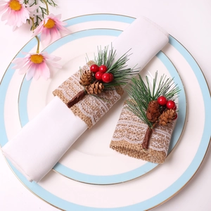 Christmas pine cone napkin rings set with jute burlap lace red berries and pine needles