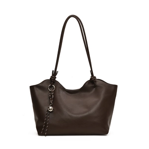 Minimalist deep brown tote bag in matte faux leather with wavy top and silver pendant
