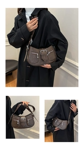 Details einer vintage dunkelbraunen Kunstleder-Schultertasche mit Schnallen und Zippern