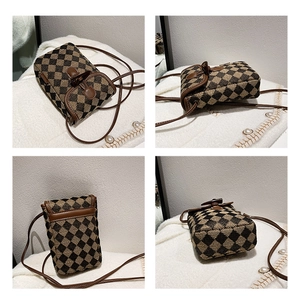 Detailed views of vintage brown checkered crossbody phone bag with leather trim and button