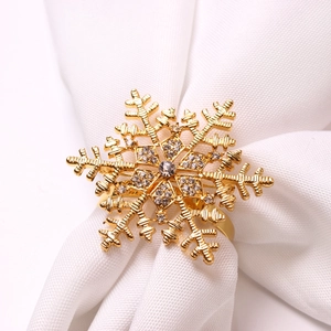 Golden snowflake napkin ring with rhinestones for elegant Christmas table decoration