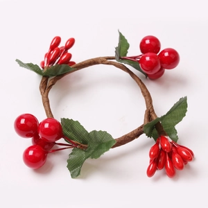 Handmade Christmas berry napkin ring with red faux berries and green leaves on white background