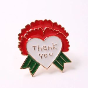 Detail of red flower napkin ring with white heart and gold 'Thank You' engraving