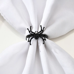 Black spider napkin ring for Halloween table decor featuring white rhinestone eyes
