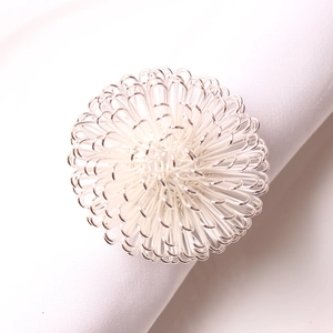Detail of silver bayberry ball napkin ring showing intricate wire wrapped metal texture
