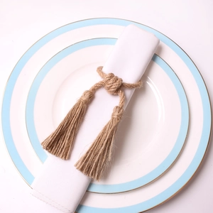 Rustic handmade hemp rope napkin ring with elegant tassels for boho table setting
