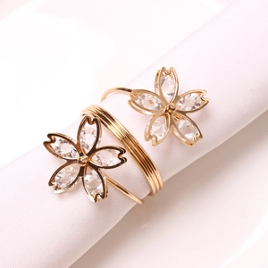 Macro view of gold-plated spring butterfly napkin ring with sparkling zircon stones