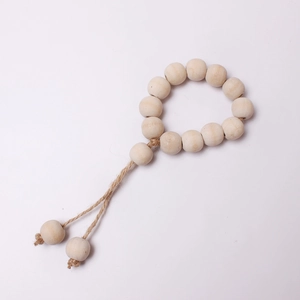 Natural wood bead napkin ring with jute rope and rustic tassel for Christmas table decor