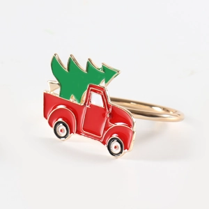 Goldener Serviettenring mit rotem Weihnachtstruck und grünem Tannenbaum aus Emaille