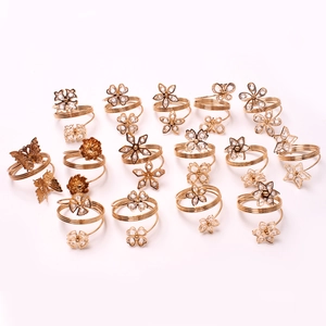 Golden butterfly and floral rhinestone napkin ring set with elegant spring spiral design