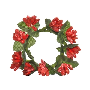 Handmade Christmas napkin ring with red berries and green leaves on white backdrop