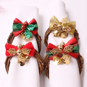Set of 4 Christmas napkin rings with rattan loops red plaid bows and festive gold bells