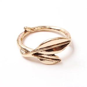 Golden double leaf napkin ring with natural branch texture for elegant table settings