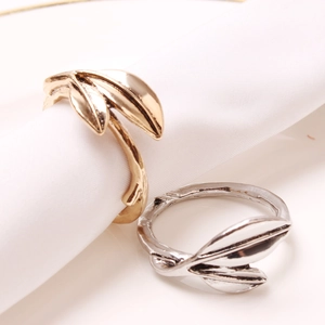 Elegant gold and silver leaf napkin rings with realistic vein textures for table decor