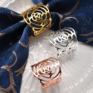 Set of hollow rose metal napkin rings in gold, silver, and rose gold for table decor