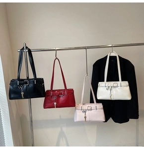 Collection of soft leather baguette bags in black red pink and white colors with key charm