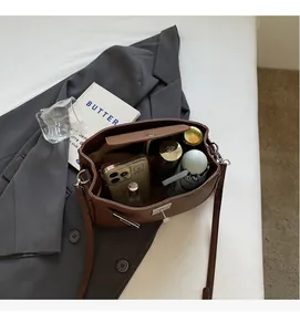 Interior view of brown leather bag showing spacious capacity for daily essentials