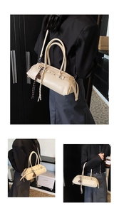 Detail of beige cylinder baguette bag with woven rope accents and slim shoulder strap