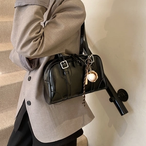Glossy black bowling tote bag with baseball charm and silver metal hardware