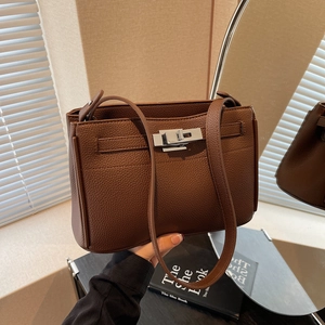 Brown litchi grain leather shoulder bag with silver twist lock and minimalist design