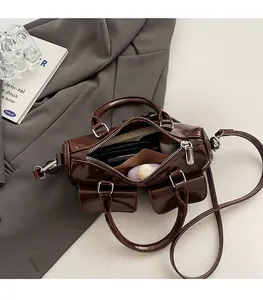 Deep brown bowling bag interior showing large capacity for wallet and cosmetics