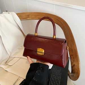 Minimalist wine red glossy PU leather square handbag with a gold metal clasp lock