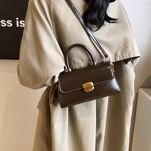 Retro dark brown top-handle square bag in glossy oil-wax leather with gold turn-lock
