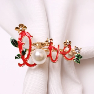 Golden LOVE napkin ring with red enamel and pearl for Valentine's table decor