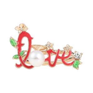 Golden LOVE napkin ring with red enamel and pearl for Valentine table setting