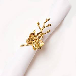 Exquisite gold orchid napkin ring with detailed petal textures for elegant table settings