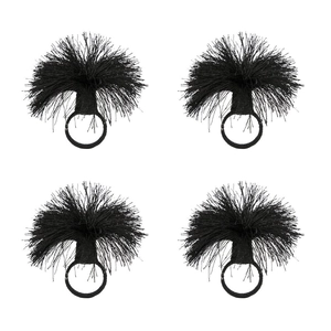 Set of four black tassel napkin rings with elegant radial design on white background
