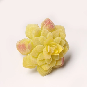 Realistic yellow succulent napkin ring with soft pink leaf tips and flocked texture