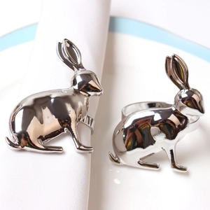 Close-up of silver bunny napkin rings with polished finish for spring table decor