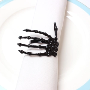 Gothic black skeleton hand napkin ring holder for spooky Halloween table setting decor