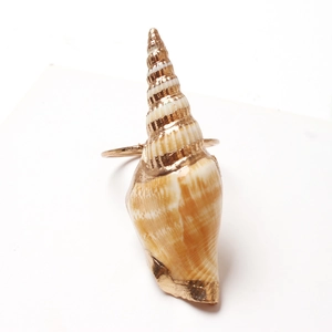 Nautical style conch napkin ring with sea shell design and elegant gold metal trim edge