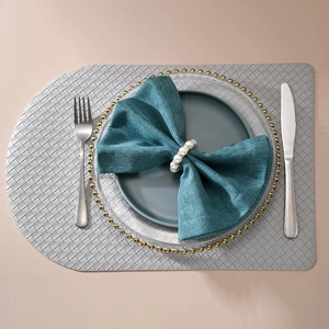Silver-grey woven placemat with semi-circle design for elegant heat-resistant dining