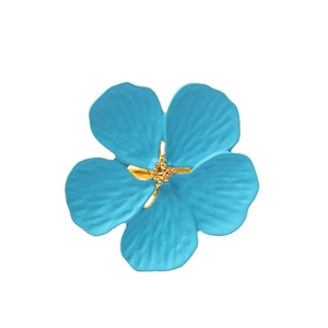 Light blue plum blossom napkin ring with textured petals and golden stamen center
